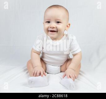 Picture of a sitting eight month old baby Stock Photo