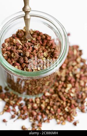 Close up of Sichuan pepper in a glass jar Stock Photo