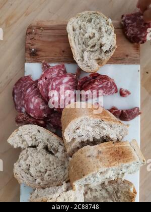 Pane e salame , bread and salami, tipical break appetizer from northern Italy Stock Photo