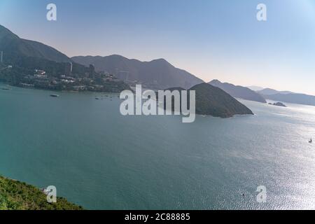 The sunny view of cable car and theme park near to ocean Stock Photo