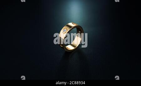 wedding rings on black background Stock Photo