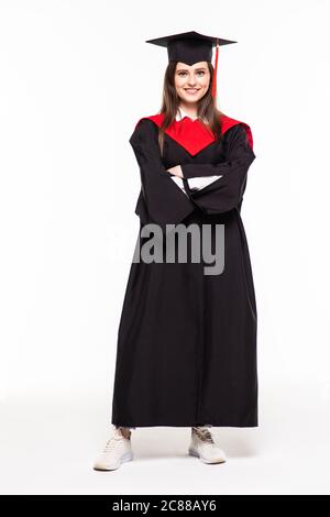 Educational theme: graduating student girl in an academic gown. Isolated over white background. Stock Photo
