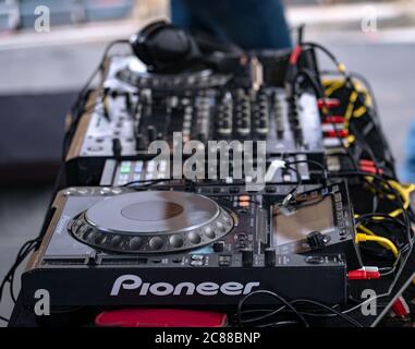 Pioneer CDJ Nexus 2000 digital DJ turntables used at a festival. Selective focus of professional DJ equipment on stage Stock Photo