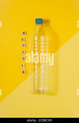 Clear Plastic Water Bottle With Yellow Plastic Bottle In Front Stock Photo Alamy