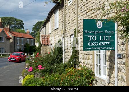 To let sign on house in the village of Hovingham, Ryedale, North Yorkshire, England UK Stock Photo