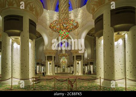 Sheikh Zayed Grand Mosque Center in Abu Dhabi, United Arab Emirates interior  view showing chandeliers , golden decoration and  carpets Stock Photo