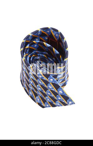 Patterned striped necktie laying on white background Stock Photo