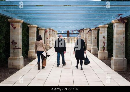 Three tourists move through the entrance to the renovated Seppeltsfield Winery complex in the Barossa Valley, South Australia, Australia. Stock Photo