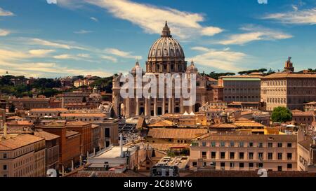 View of St. Peter's Basilica in the Vatican, over the roofs of Rome Stock Photo