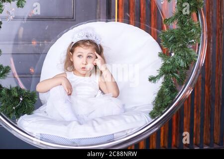 Happy amazed female kid emotion. Suprised and thinking child studio portrait Stock Photo