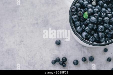 Fresh Blueberry Background. Texture blueberry berries close up. Sprinkle blueberries. Ripe blueberries with copy space for text Stock Photo