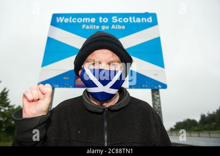 Scottish/English Border at Berwick, Scotland, UK. 22 July 2020 Pictured:  Sean Clerkin of Action For Scotland.  All people must stop travelling from England to Scotland for non essential reasons to protect the people of Scotland from Covid-19. New cases of Covid-19 Are 5.5 Times higher In England than Scotland and Professor Rowland Kao a mathematical biologist at EDINBURGH University stated recently that if there is increased travel between England and Scotland it is inevitable that cases of Covid-19 will increase in Scotland. Credit: Colin Fisher/Alamy Live News. Stock Photo