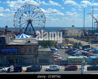 Looking out from the elevated Q train at the amusement park and Atlantic Ocean at Coney Island, Brooklyn, New York. Stock Photo