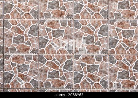 Texture of a wall tiled with a giraffe skin pattern. Abstract image for the background. Stock Photo