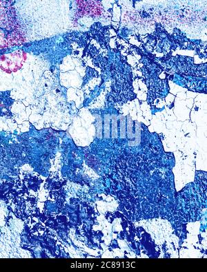 Fragment of colorful graffiti painted on a wall. Bright abstract background for design with peeling paint. Stock Photo
