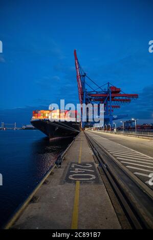 Hamburg, Germany. 16th July, 2020. A fully loaded ship is moored at Container Terminal Altenwerder in the Port of Hamburg. Credit: Daniel Reinhardt/dpa/Alamy Live News Stock Photo