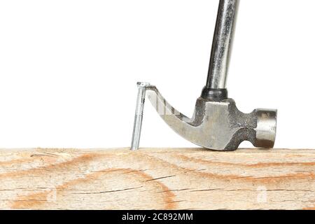 removing a nail from wood with hammer Stock Photo