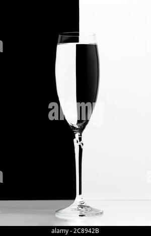 balck and white refraction through glass of champagne Stock Photo