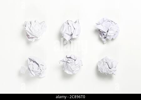 white crumpled paper balls on white surface Stock Photo