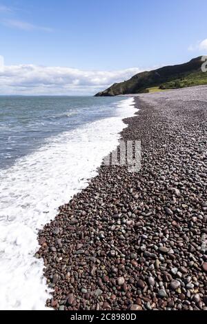 The  shingle and pebble barrier ridge of Bossington Beach looking towards Hurlstone Point on the coast of  Exmoor National Park, Somerset UK Stock Photo