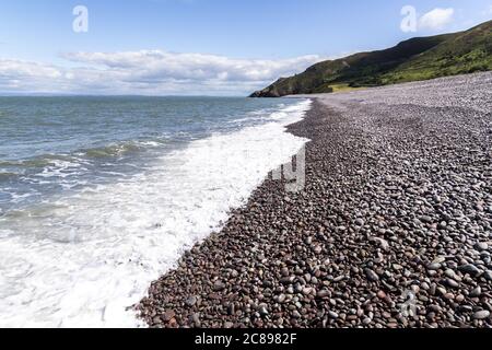 The  shingle and pebble barrier ridge of Bossington Beach looking towards Hurlstone Point on the coast of  Exmoor National Park, Somerset UK Stock Photo