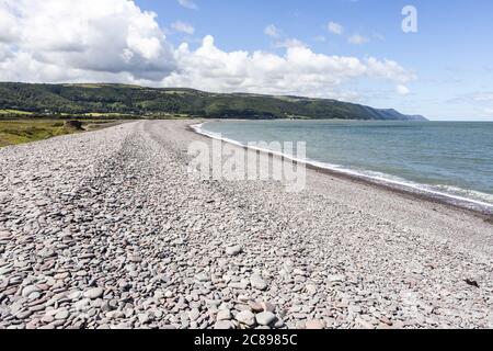 The  shingle and pebble barrier ridge of Bossington Beach looking towards Porlock Weir on the coast of  Exmoor National Park, Somerset UK Stock Photo