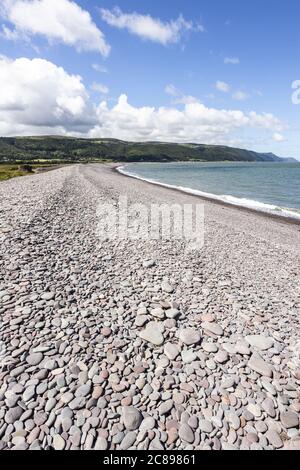 The  shingle and pebble barrier ridge of Bossington Beach looking towards Porlock Weir on the coast of  Exmoor National Park, Somerset UK Stock Photo