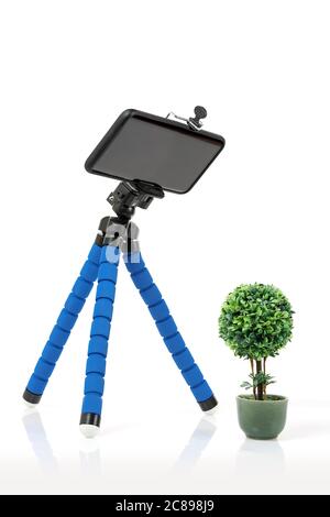 smart phone on flexible tripod isolated on white, product photography Stock Photo