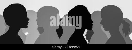 Monochrome concept image of ethnically diverse silhouetted heads communicating one-to-one and in a group, female profiles to the forefront Stock Photo