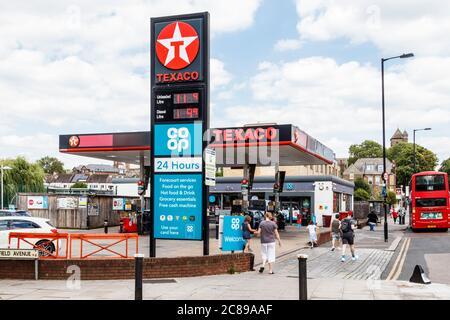 Texaco filling station and Co-Op 24-hour mini supermarket in Crouch End, London, UK