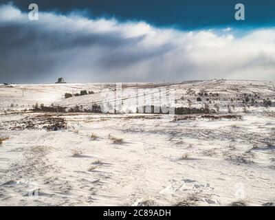 Snow covered North Yorkshire Moors with RAF Fylingdales AN/FPS-126 Pave Paws Solid State Phased Array Radar System in background, UK. Stock Photo