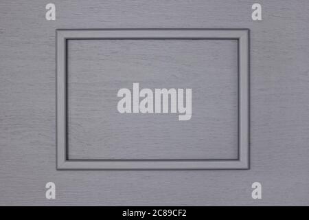 Empty gray wooden picture frame on grey painted wood wall. Creative mockup background Stock Photo