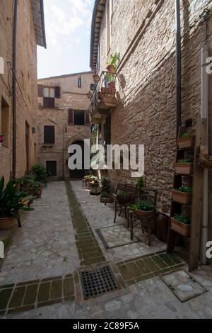 typical narrow street in the old town of Spello, Umbria, Italy Stock Photo