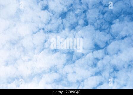 white fleecy clouds in blue sky, altocumulus fluffy clouds background Stock Photo