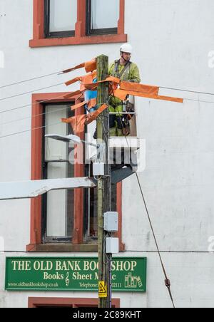 Keltbray electrical engineers replace overhead power cables in Wigtown town centre, Dumfries & Galloway, Scotland. Stock Photo