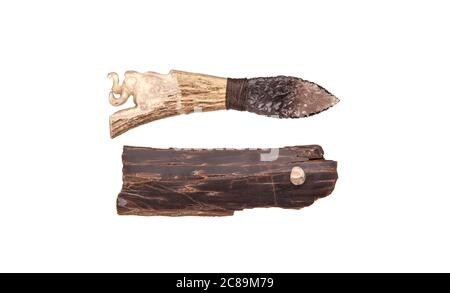 Obsidian knife with bone handle isolate on a white background. Prehistoric weapon made of volcanic glass. Stock Photo