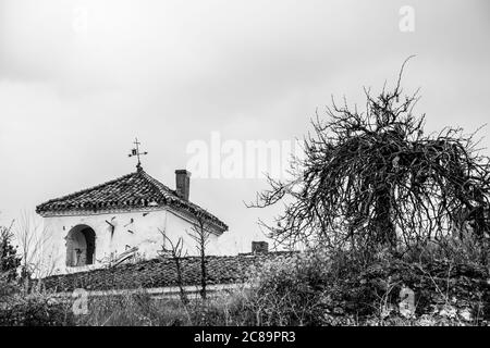 Abandoned house in black and white on a stormy day Stock Photo