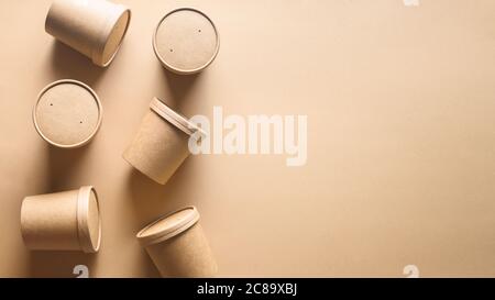 Craft paper soup cups on brown paper. Ecological individual package. Zero Waste. Stock Photo