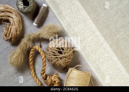 Linen textile products, fabric, threads, yarn and rope. Top view Stock Photo
