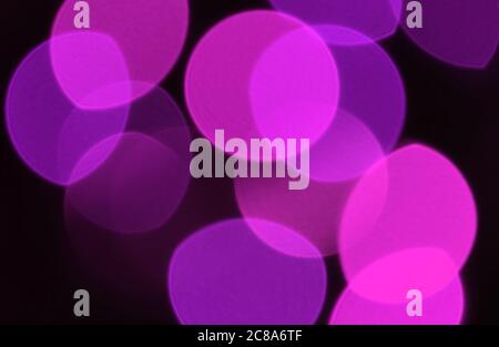 Abstract Blurred Purple Pink Splashing Illuminated Light on Black Background Stock Photo