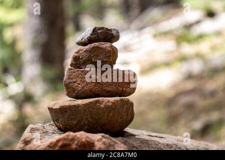 Rock Stack or Cairn marking the way along the trail around the beautiful Woods Canyon Lake, in Northern Arizona, on top of the Mogollon Rim. Stock Photo