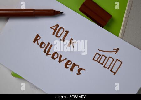 401k Rollovers text on sticky notes isolated on office desk. Stock Photo