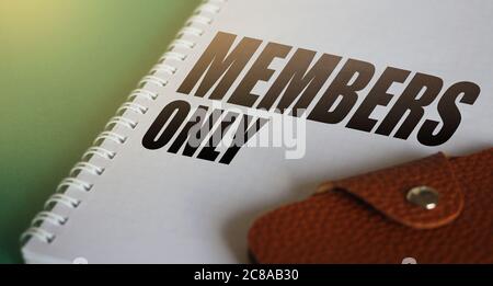 Members Only text on copybook page and wallet. VIP services business Concept Stock Photo