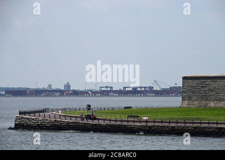 With the Manhattan skyline in the background, a view of the base of the Statue of Liberty as Liberty Island is once again accessible to visitors as part of New York City's Phase 4 reopening, but access to the statue, including crown and pedestal, remains closed due to COVID-19 restrictions, New York, NY, July 22, 2020. Since opening on Monday, the usual crowds of tens of thousands of people have been absent, instead a slow stream of only a few hundred tourists have been counted visiting “Lady Liberty”. (Anthony Behar/Sipa USA) Stock Photo