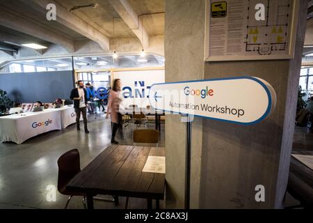 BUCHAREST, ROMANIA - FEBRUARY 12, 2020: Google logo on entrance of a workshop on automated bidding. Google Partners is a program between Google & mark Stock Photo