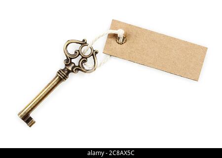 antique key with blank tag isolated on white Stock Photo