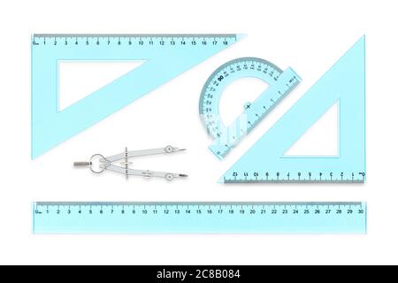 transparent rulers, protractor and compasses isolated on white Stock Photo