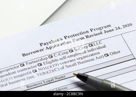 The Paycheck Protection Program (PPP) Borrower Application Form. PPP loan provides an incentive for small businesses to keep their workers on payroll. Stock Photo