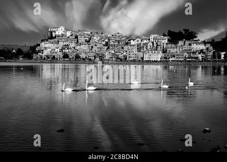 Monochrome image of Anguillara from Bracciano lake  after thunderstorm. Anguillara is a small village on Bracciano lake. Stock Photo