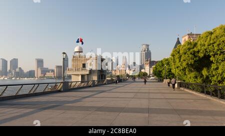 Shanghai, China - April 17, 2018: Panorama of the waterfront promenade at Huangput River. Better known as The Bund (Waitan). Empty, only few people du Stock Photo